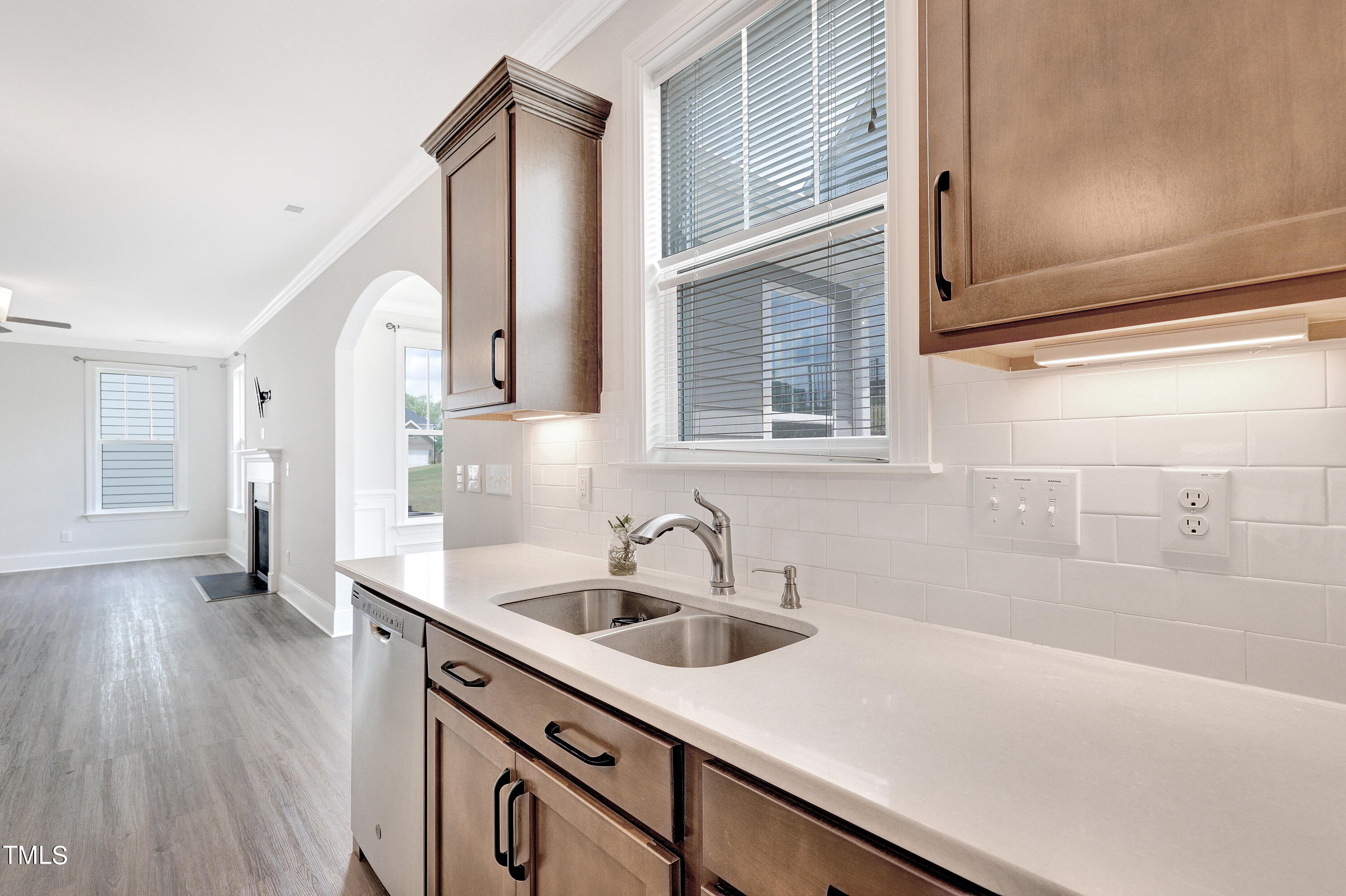 2153 Sweet Samson Street Wake Forest, NC 27587 - Photo 10 of 47 a kitchen with a sink and a refrigerator