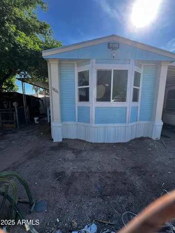 a view of house with backyard