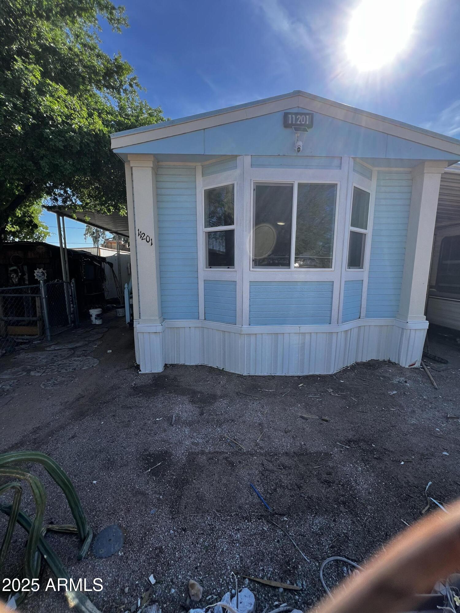a view of house with backyard
