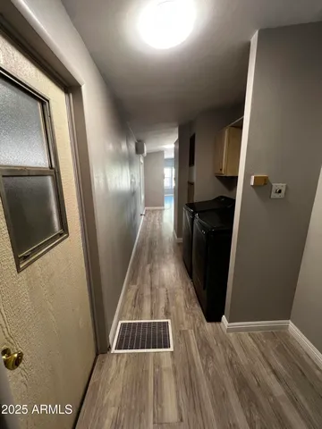 a kitchen with a sink and a refrigerator