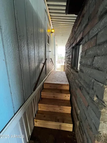 a kitchen with a sink a stove and a wooden cabinets