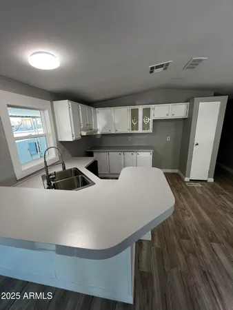 a view of a livingroom with wooden floor