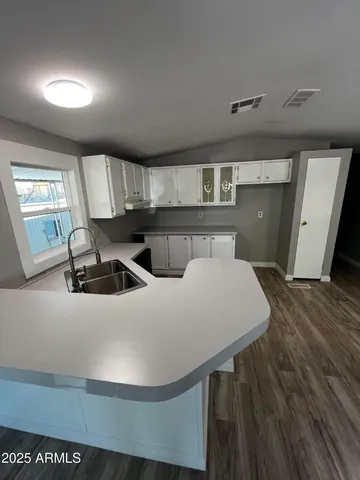 a view of a livingroom with wooden floor