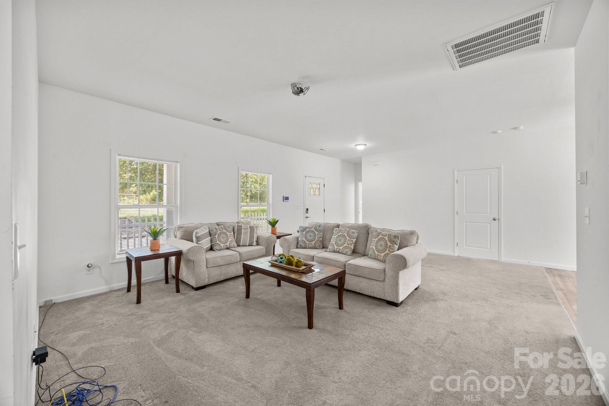 14532 East Rocky River Road Davidson, NC 28036 - Photo 13 of 32 a living room with furniture and a window