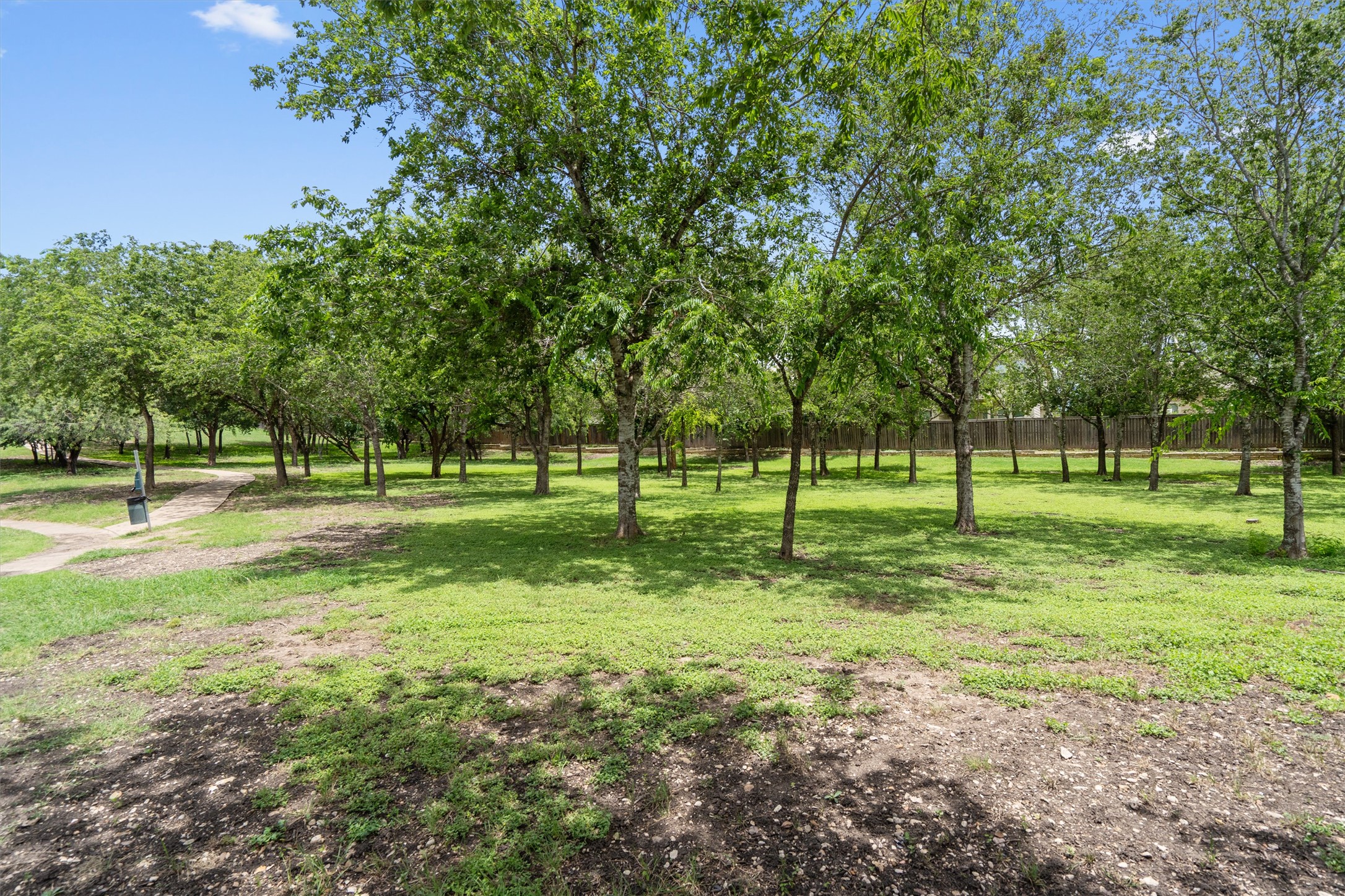 5825 Silver Screen Drive Austin, TX 78747 - Photo 37 of 40 Green space with abundant mature trees and a tranquil walking path defines this inviting natural setting.