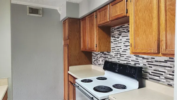 a kitchen with a stove and a sink