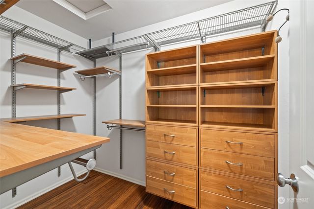 a spacious bedroom with a bed and a window