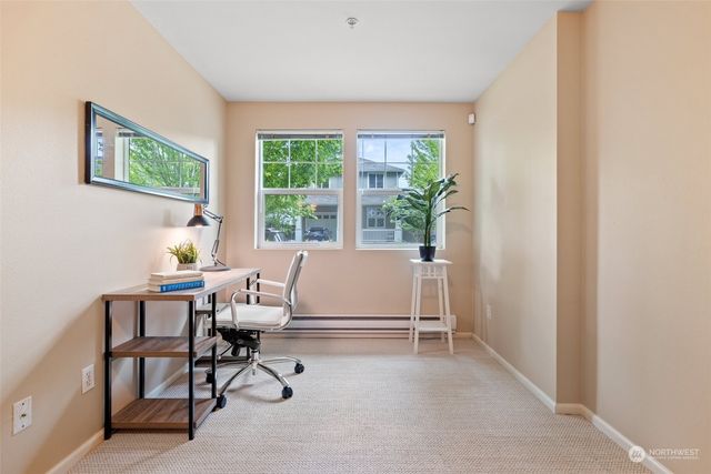 swimming pool view with a seating space