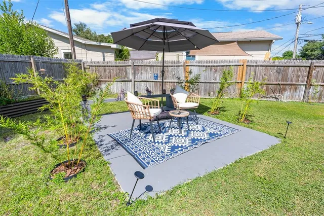 a view of an outdoor sitting area with furniture