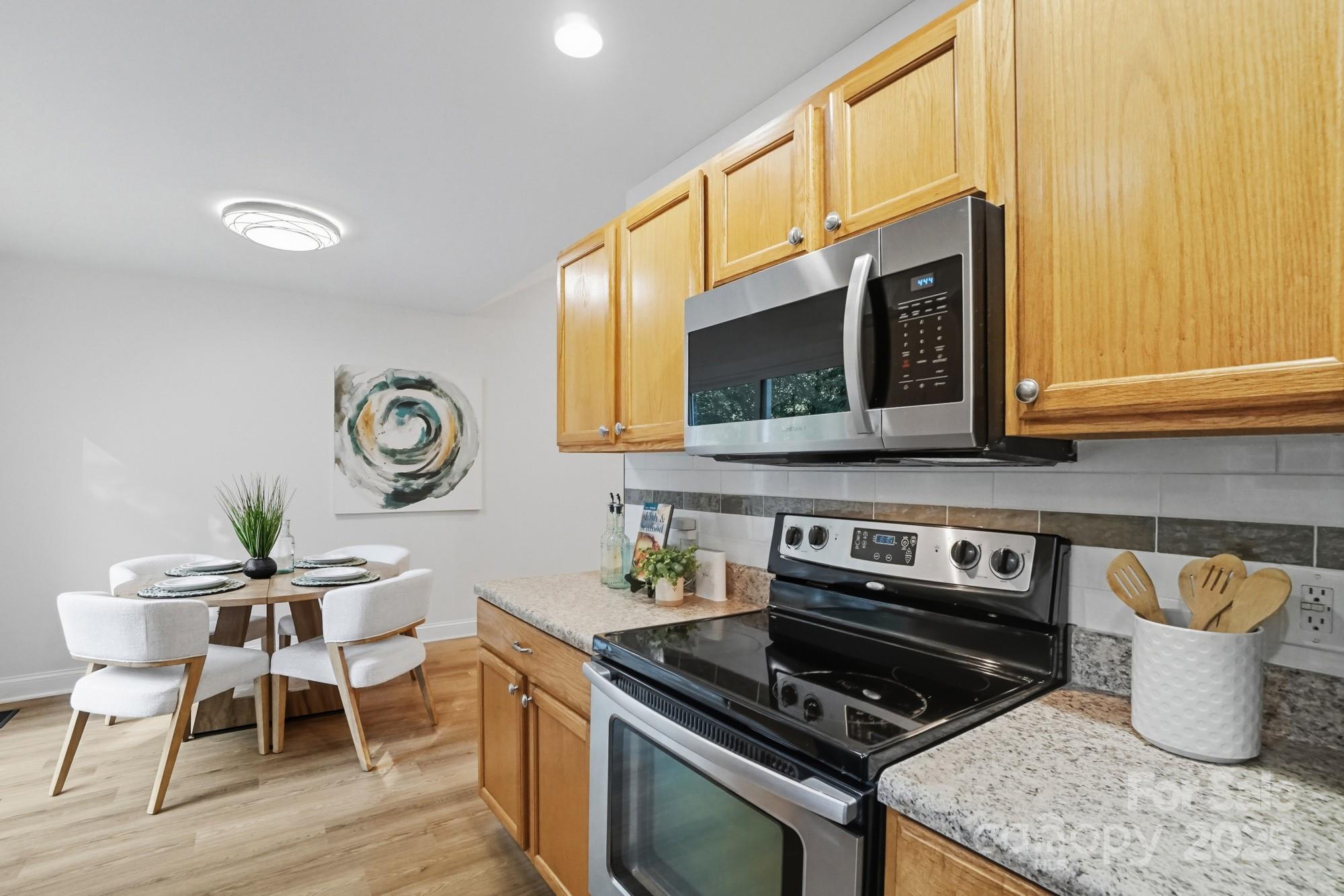 324 West Shiloh Unity Road Lancaster, SC 29720 - Photo 11 of 28 a kitchen with a stove and a microwave