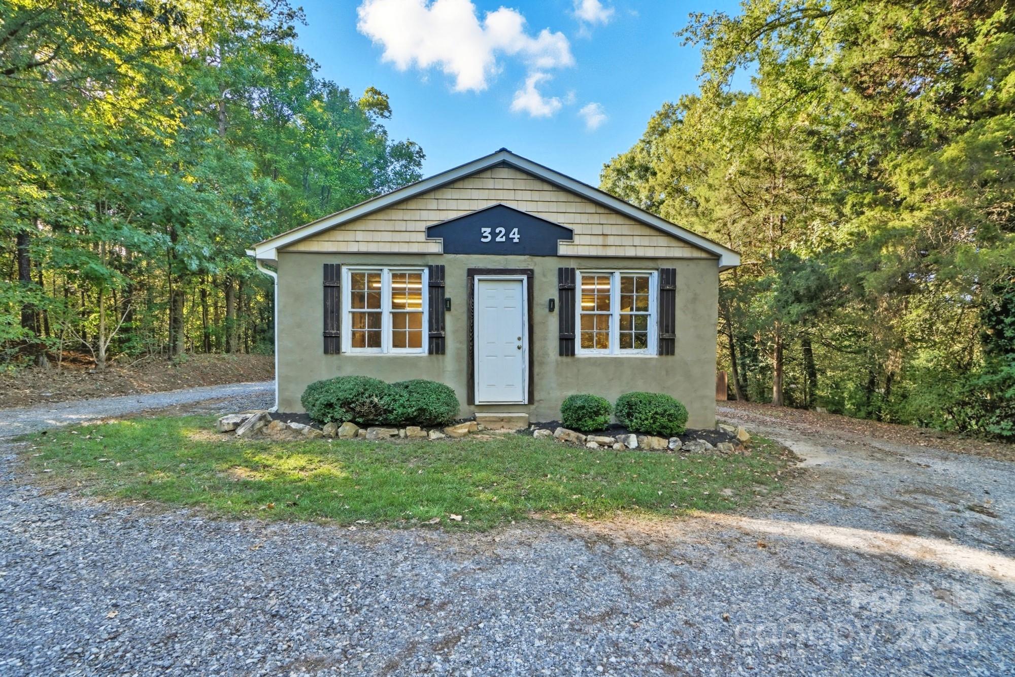 324 West Shiloh Unity Road Lancaster, SC 29720 - Photo 24 of 28 a view of a house with a yard
