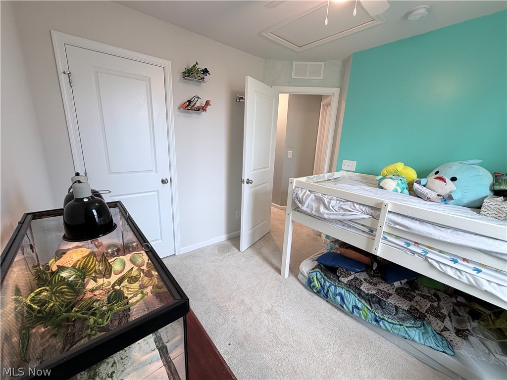 177 Raintree Lane Painesville, OH 44077 - Photo 14 of 40 Bedroom featuring light colored carpet and ceiling fan