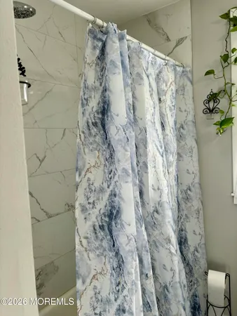 a bathroom with a shower curtain