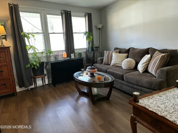 a living room with furniture and a table