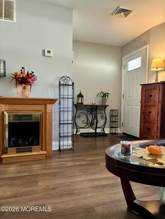a living room with furniture and fireplace