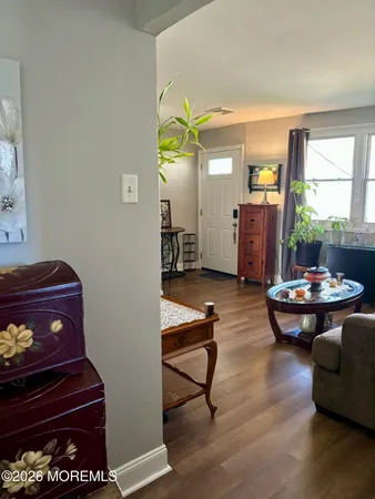 a living room with furniture and a rug