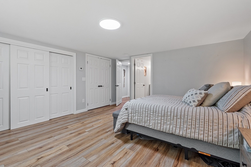 96 Willard Road Ashburnham, MA 01430 - Photo 14 of 30 a bedroom with a bed and wooden floor