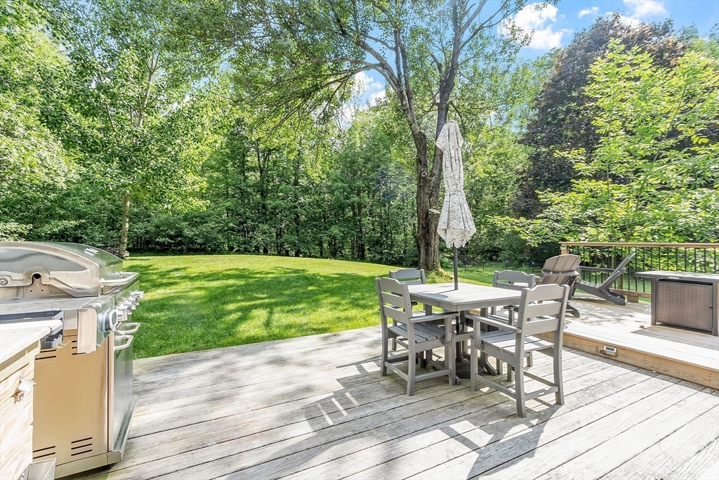 96 Willard Road Ashburnham, MA 01430 - Photo 24 of 30 a view of a patio with a table chairs and a patio