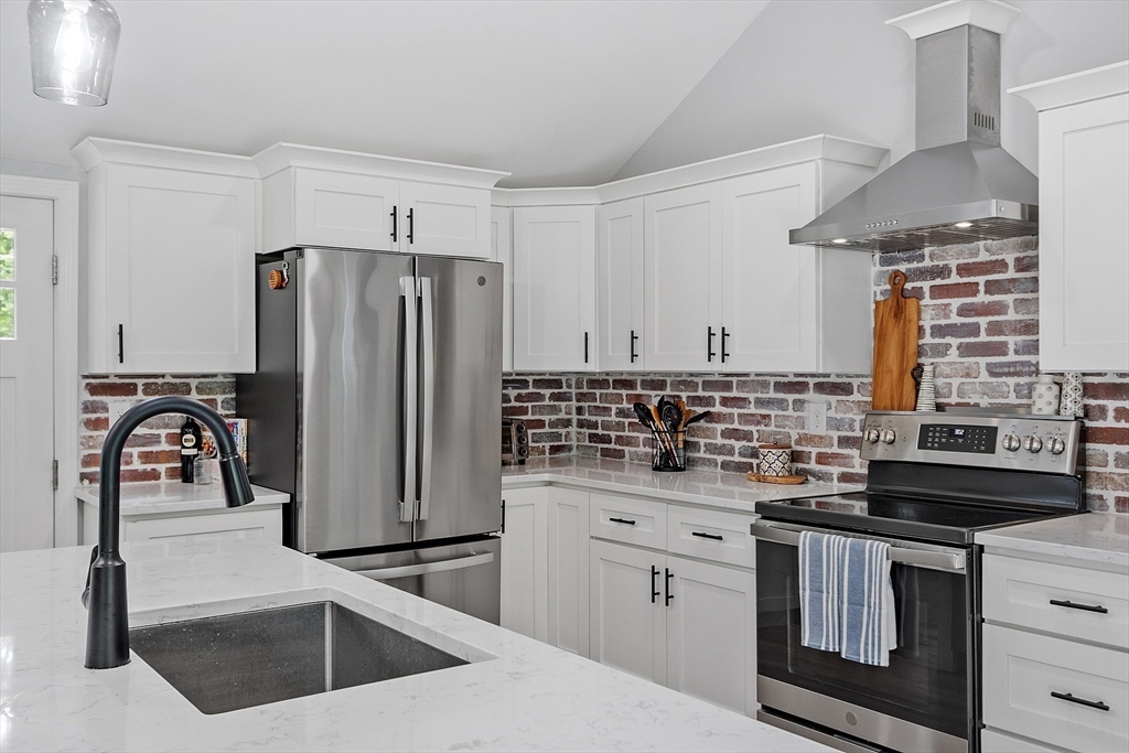 96 Willard Road Ashburnham, MA 01430 - Photo 5 of 30 a kitchen with granite countertop a sink stainless steel appliances and cabinets