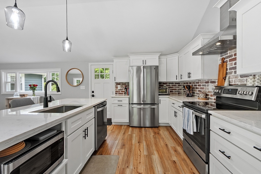 96 Willard Road Ashburnham, MA 01430 - Photo 6 of 30 a kitchen with a sink stove and refrigerator