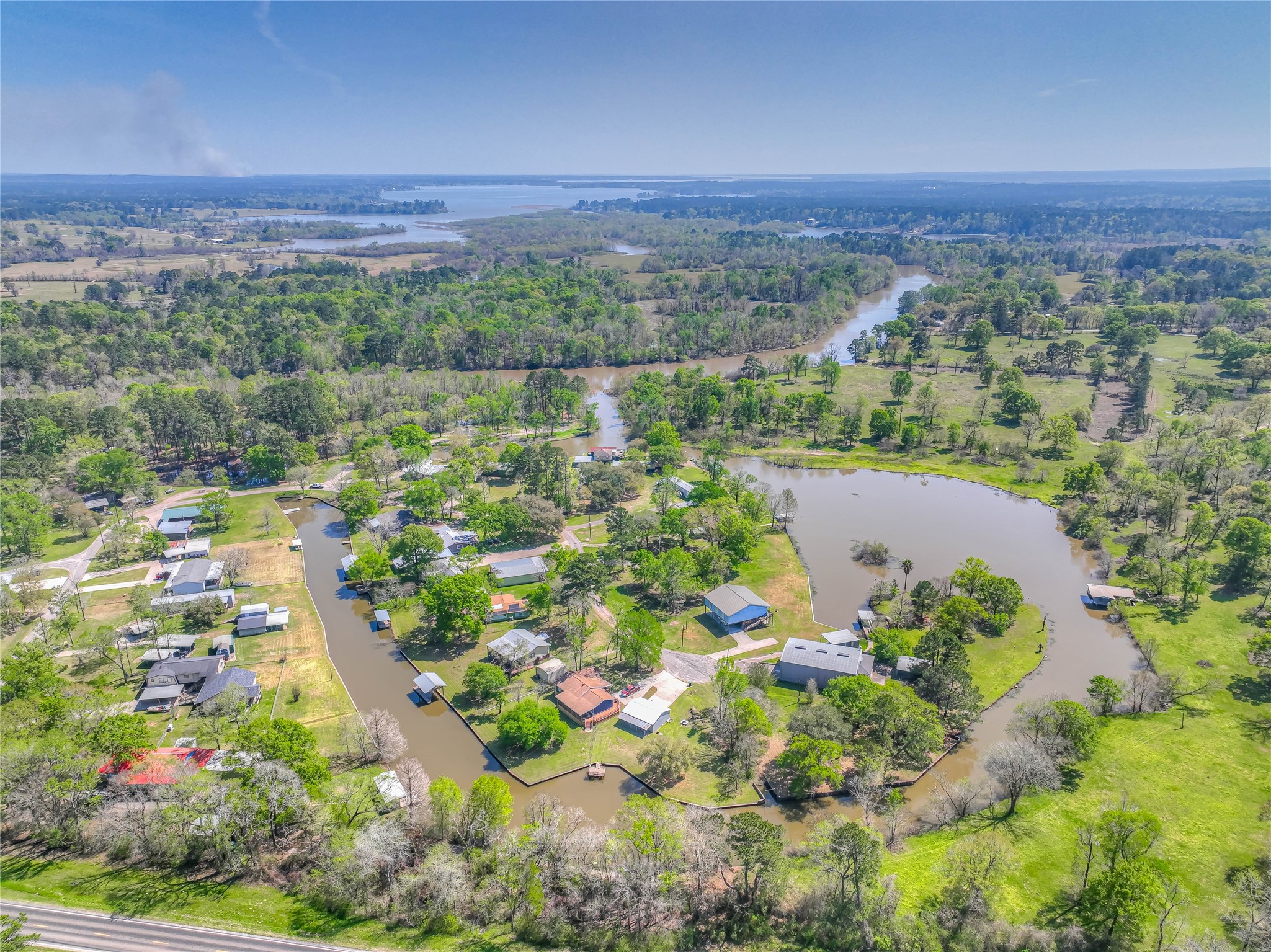 426 Deer Run Road Trinity, TX 75862 - Photo 17 of 18 a view of a lake with a mountain in the background