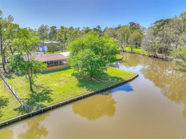 a view of a swimming pool with an outdoor seating and yard