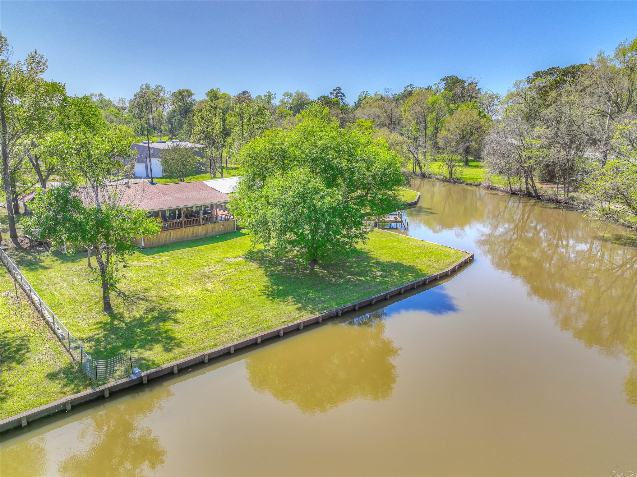426 Deer Run Road Trinity, TX 75862 - Photo 4 of 18 a view of a swimming pool with an outdoor seating and yard