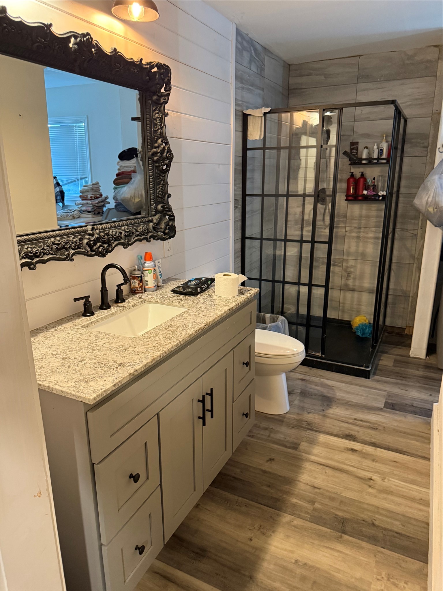 426 Deer Run Road Trinity, TX 75862 - Photo 8 of 18 a bathroom with a granite countertop sink toilet and shower