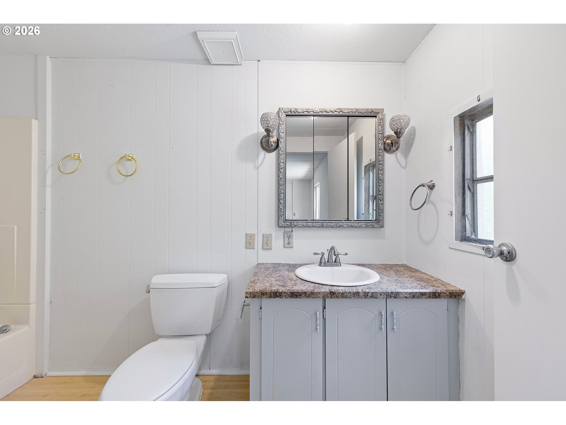 1600 Rhododendron Drive, Unit 429 Florence, OR 97439 - Photo 28 of 47 a bathroom with a toilet sink and mirror