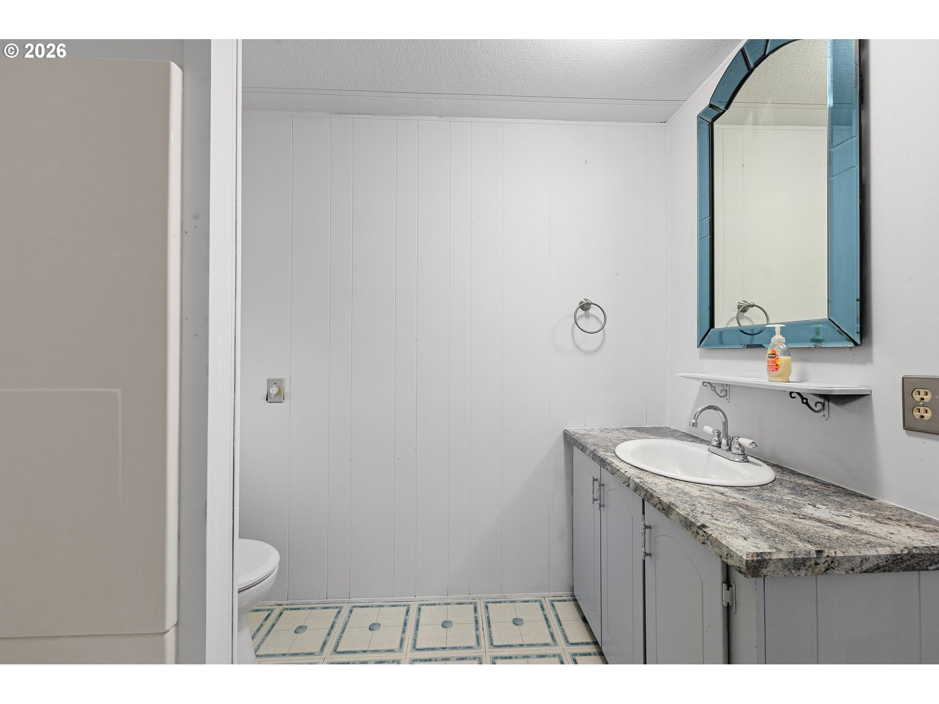 1600 Rhododendron Drive, Unit 429 Florence, OR 97439 - Photo 30 of 47 a bathroom with a sink and a mirror