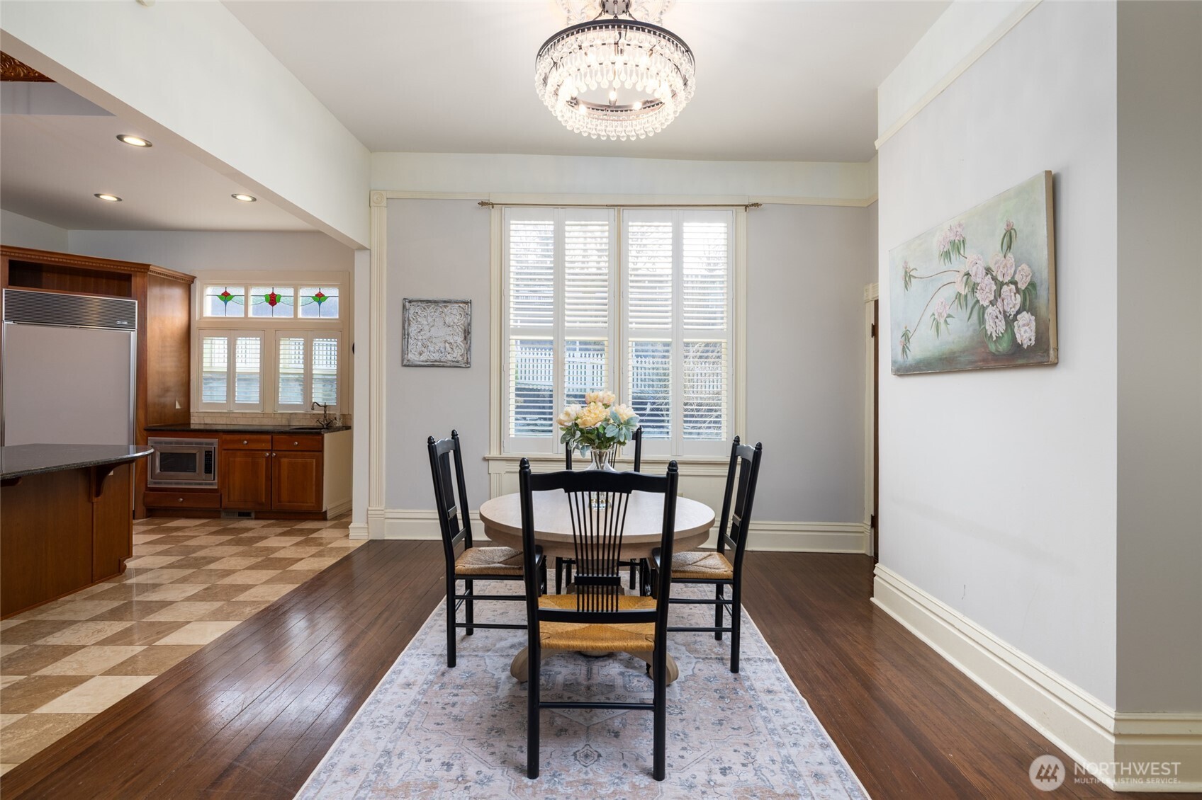 303 Benton Street La Conner, WA 98257 - Photo 13 of 40 a view of a dining room with furniture window and wooden floor