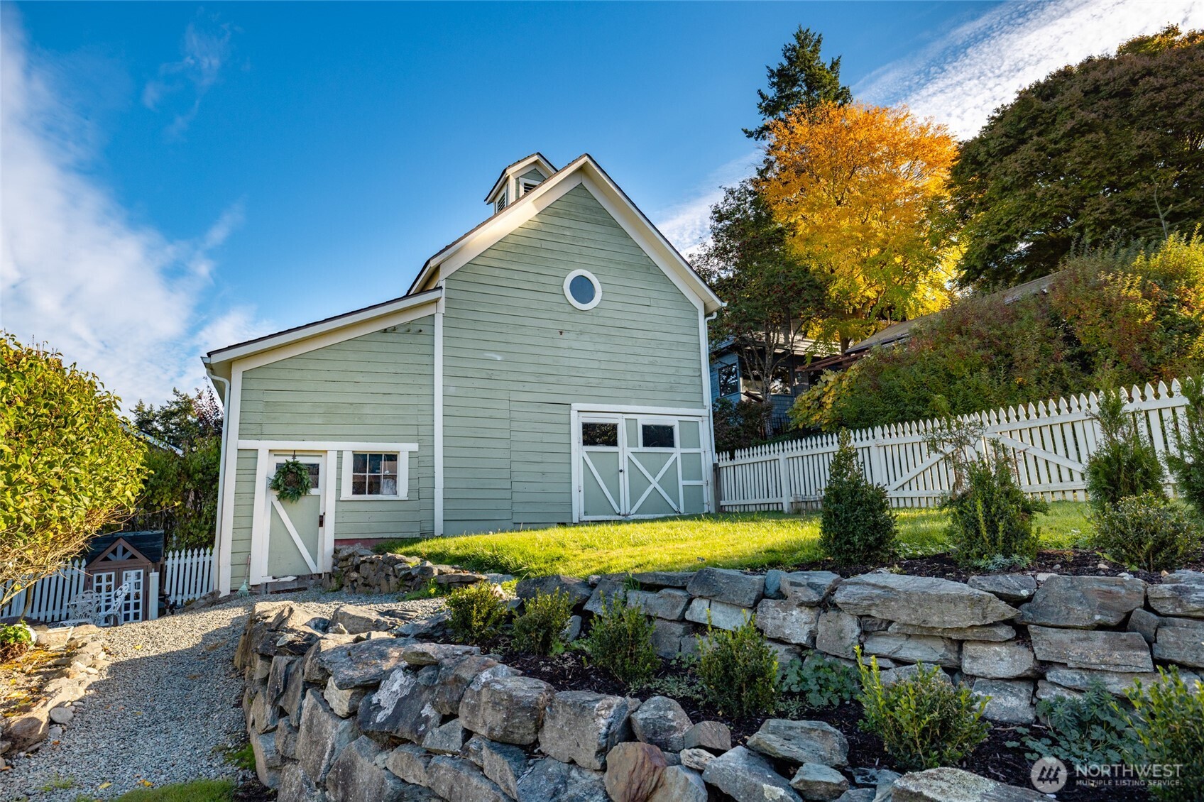 303 Benton Street La Conner, WA 98257 - Photo 27 of 40 a view of a house with swimming pool and a yard