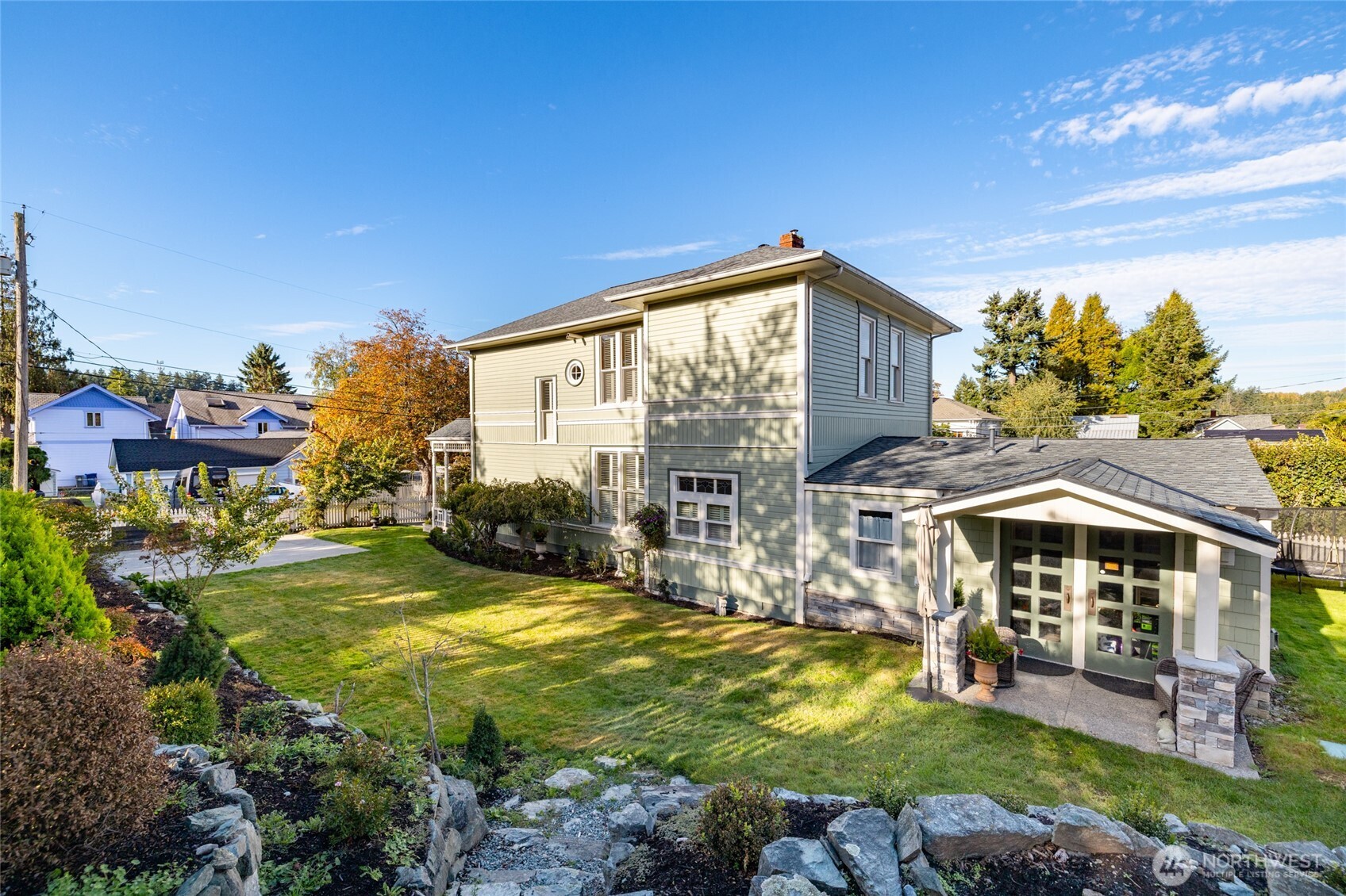 303 Benton Street La Conner, WA 98257 - Photo 35 of 40 a view of a house with swimming pool and sitting area
