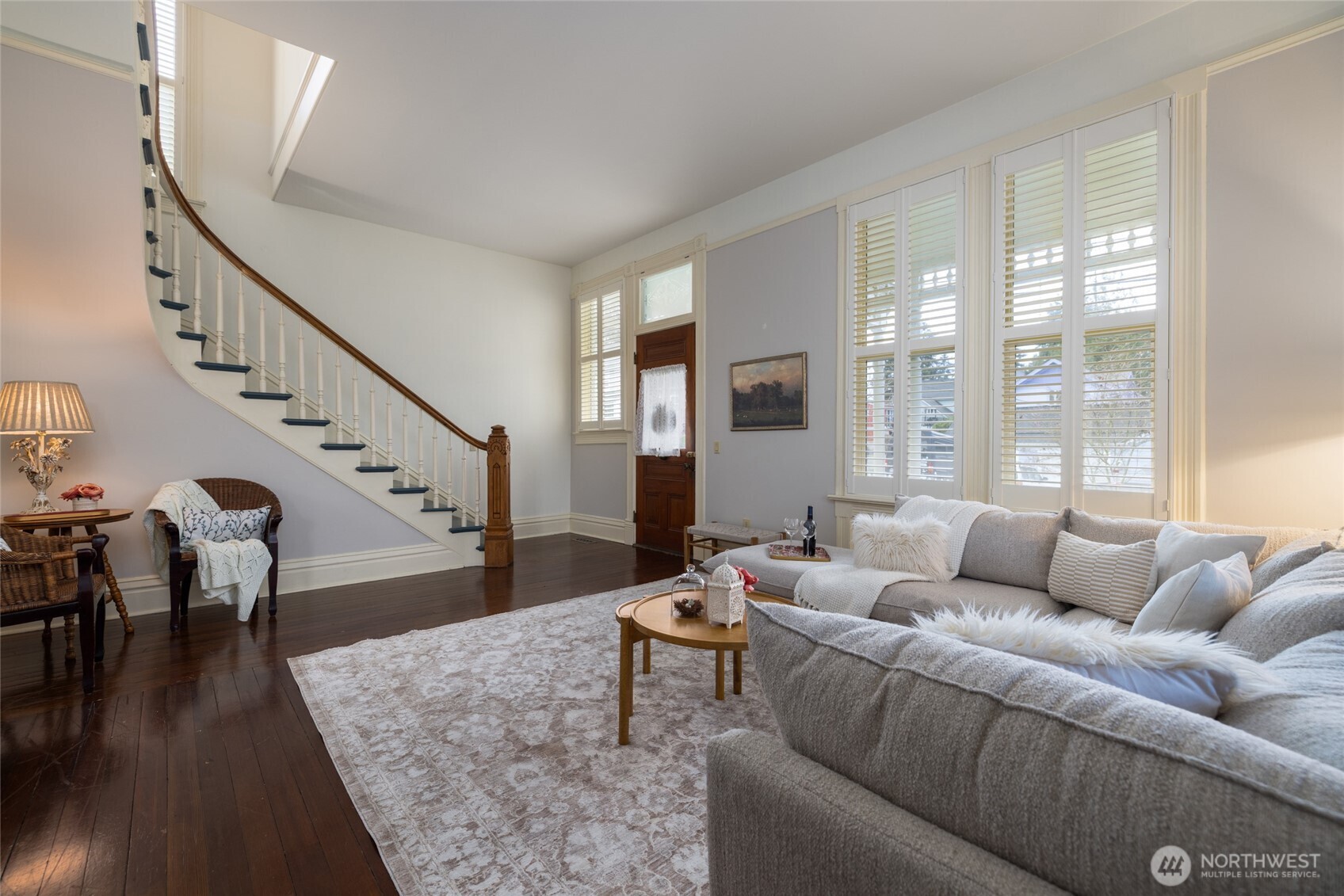 303 Benton Street La Conner, WA 98257 - Photo 4 of 40 a living room with furniture and wooden floor next to a window
