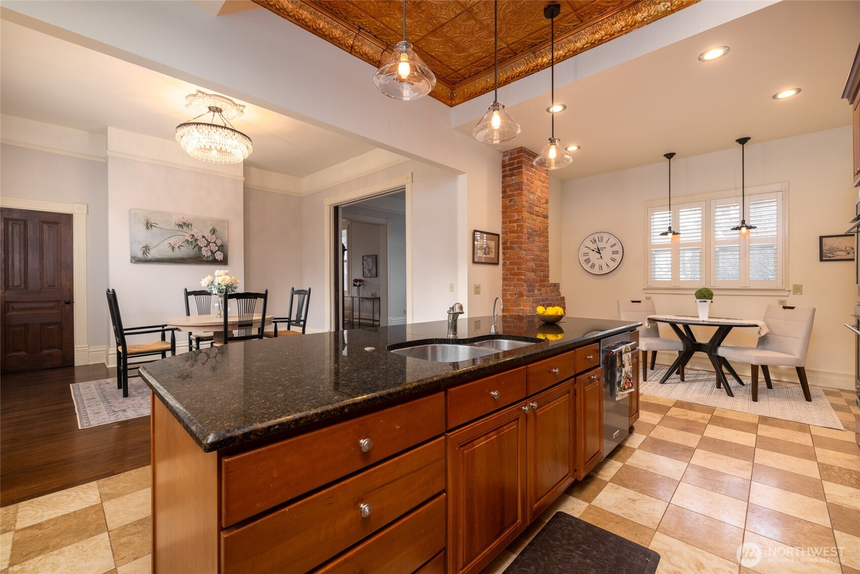 303 Benton Street La Conner, WA 98257 - Photo 10 of 40 a kitchen with granite countertop a sink a counter space appliances and cabinets