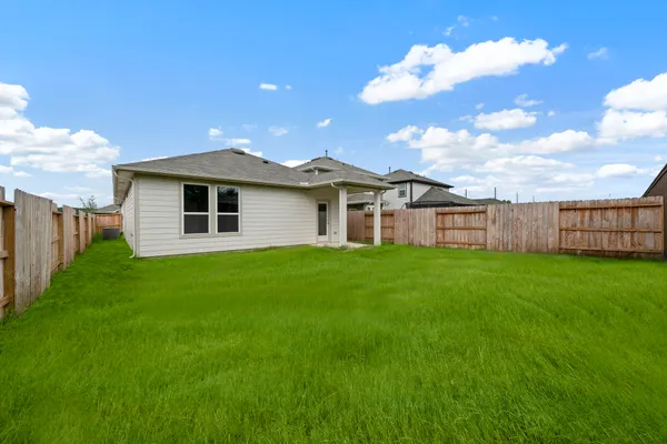a view of a house with a backyard