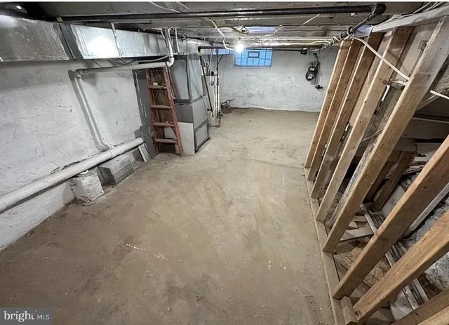 a view of walk in closet with clothes