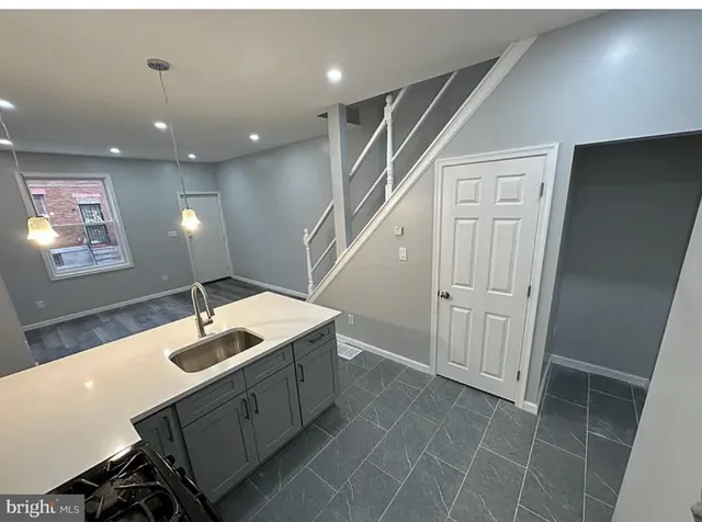 a bathroom with a sink a vanity and a mirror