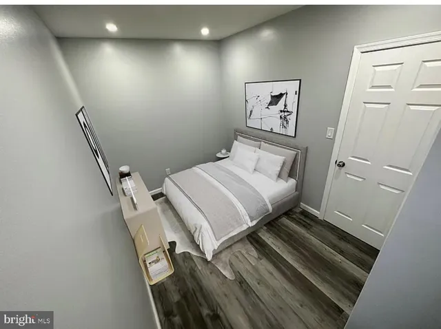 a bedroom with a bed and the view of bathroom