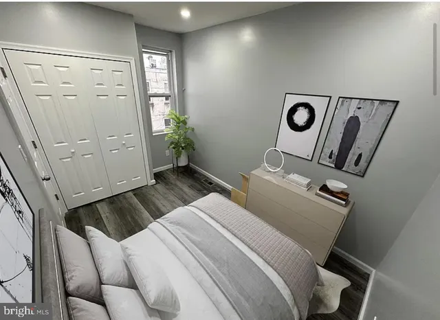 a bedroom with a bed and a mirror