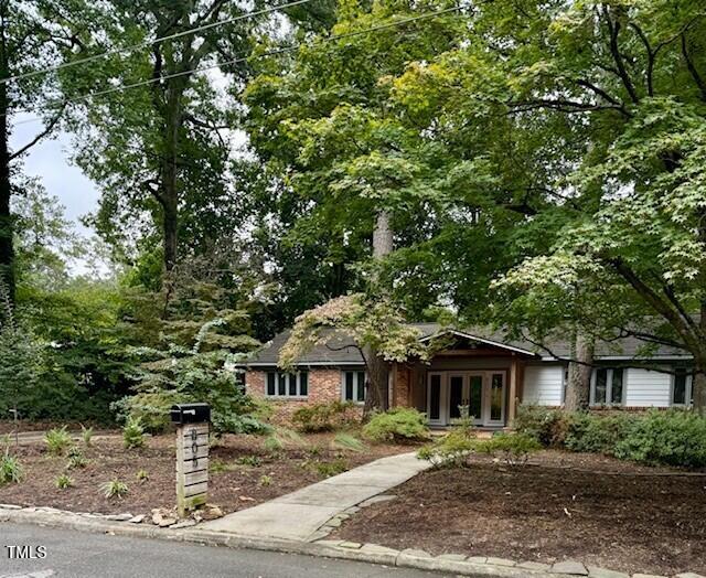 805 Burke Street Raleigh, NC 27609 - Photo 2 of 4 a front view of a house with a yard