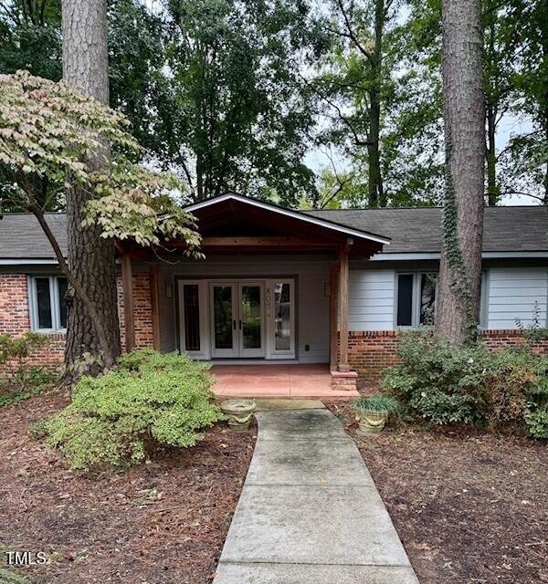 805 Burke Street Raleigh, NC 27609 - Photo 3 of 4 a front view of a house with a garden
