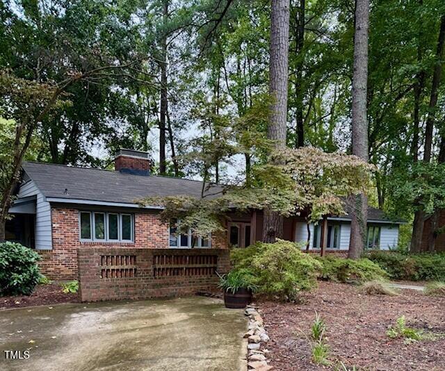 805 Burke Street Raleigh, NC 27609 - Photo 4 of 4 a view of a brick house with a large windows