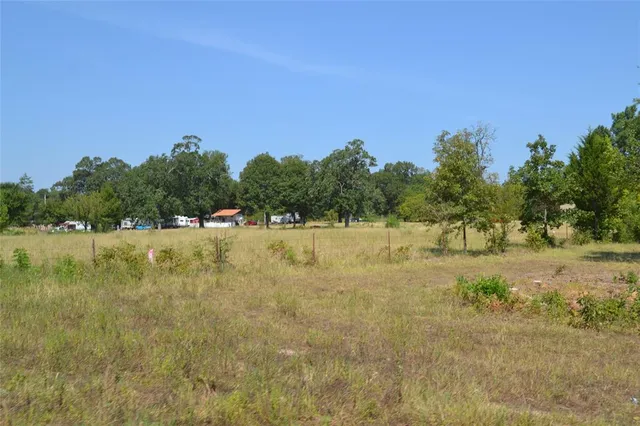 a view of lake with green space