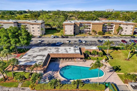 an aerial view of a house with a swimming pool