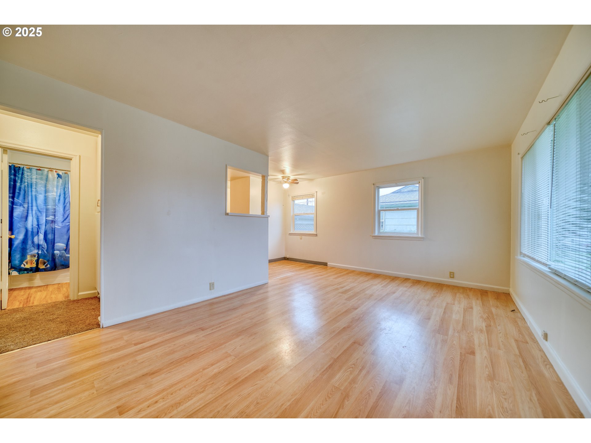 1924 Tualatin Street St. Helens, OR 97051 - Photo 12 of 27 a view of an empty room with wooden floor and a window