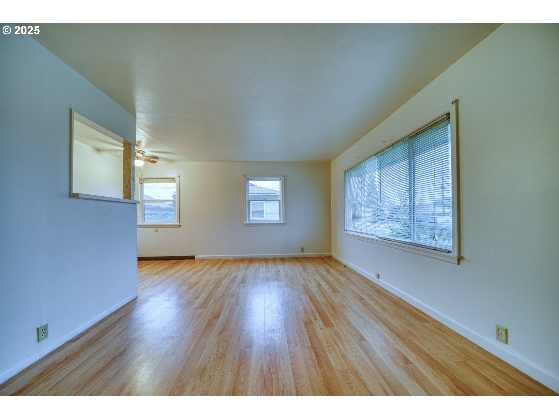 1924 Tualatin Street St. Helens, OR 97051 - Photo 14 of 27 a view of an empty room with wooden floor and a window