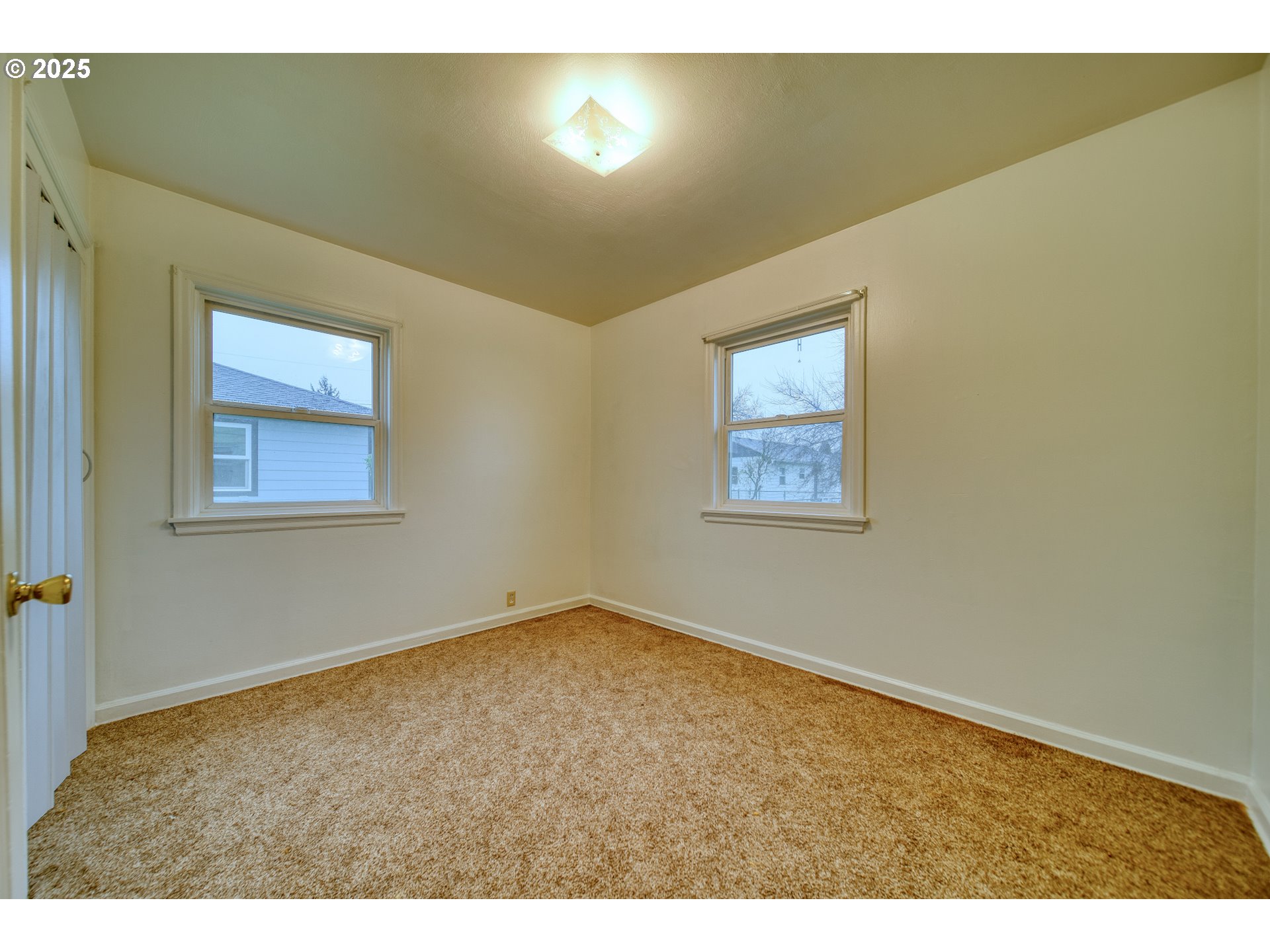 1924 Tualatin Street St. Helens, OR 97051 - Photo 22 of 27 a view of an empty room with a window