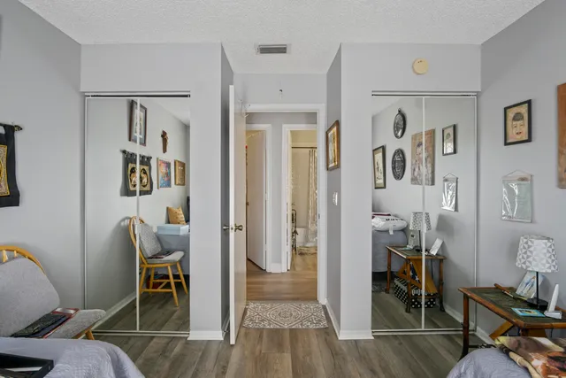 a view of a livingroom with furniture and workspace