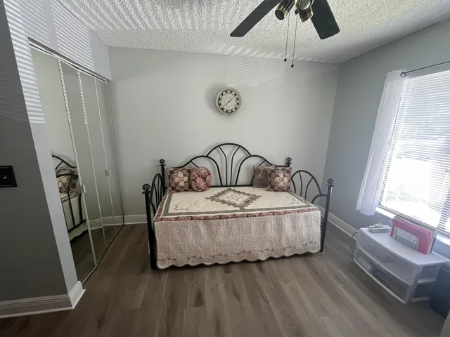 a bedroom with a bed and window